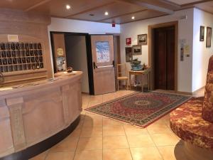 a lobby of a wine store with a counter at Albergo La Bicocca in Paneveggio