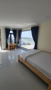 Ένα ή περισσότερα κρεβάτια σε δωμάτιο στο Hoàng Hôn Nhớ