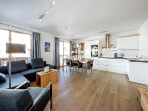 a living room with a couch and a table at Apartment in Gerlos near Ski Lift in Gerlos +31 photos