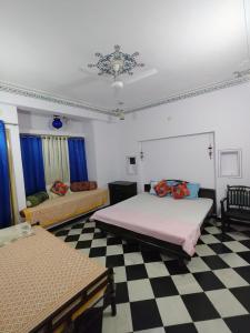 Ένα ή περισσότερα κρεβάτια σε δωμάτιο στο RELAX INN By MARIGOLD FAMILY Guest House