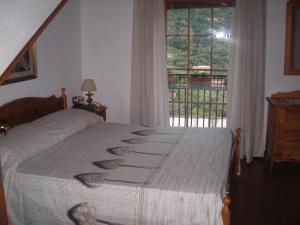 Postel nebo postele na pokoji v ubytování B&B L'Arcobaleno