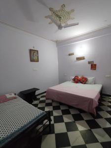 Ένα ή περισσότερα κρεβάτια σε δωμάτιο στο RELAX INN By MARIGOLD FAMILY Guest House +23 φωτογραφίες