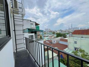 a balcony with a view of a city at Hạt Nắng Garden - Homestay & Restaurant in Ho Chi Minh City