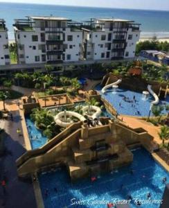a resort with a water park with a slide at Pool & Sea View Casa Azalea at Swiss Garden Resort Residence - 2 bedroom apartment in Kuantan