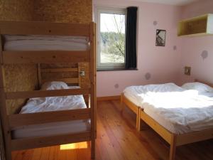 two bunk beds in a room with a window at Home in Vielsalm with Sauna in Vielsalm