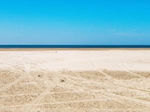 an empty beach with the ocean in the background at 7 person holiday home in Fanø-By Traum in Fanø