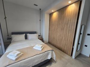 Ένα ή περισσότερα κρεβάτια σε δωμάτιο στο Ilia Suites 1