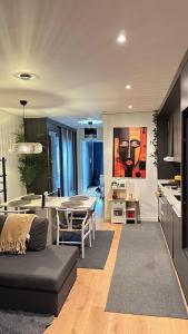 a living room with a couch and a table at 2bedroom apartment in Haninge in Mårtensberg