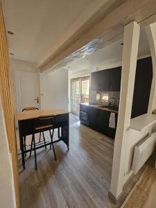 a kitchen with a desk and a table in a room at Mediterranean Studio in Saint-Cyprien +5 photos