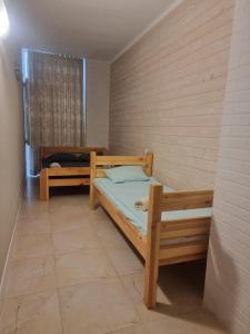 a bedroom with two bunk beds in a room at Gold Bugaz in Odesa