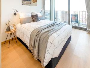 En eller flere senge i et værelse på Apartment in Oostende for 6 Person