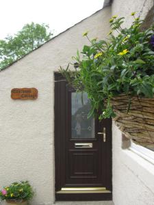 The facade or entrance of Eastwood Cottage