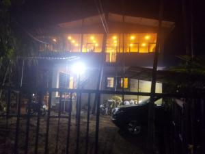 a car parked in front of a building at night at Dlite villa home stay in Revadanda +3 photos
