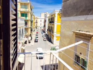 a view of a city street with cars on the road at Little Home in Trani