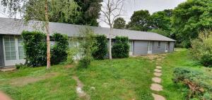 a house with a yard in front of it at Gites de Coulonge in Coulonges-Ardennes +3 photos