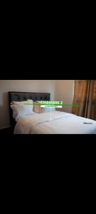 Postel nebo postele na pokoji v ubytování ATD Thérésa guest house