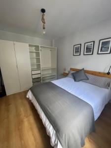 a bedroom with a large white bed in it at La casita de Nicolás in Escarrilla