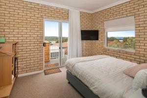 Et tv og/eller underholdning på Baywatch Retreat Augusta