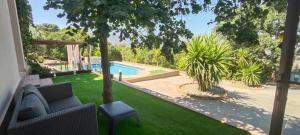a view of a yard with a swimming pool at Villa Boreal in El Gastor