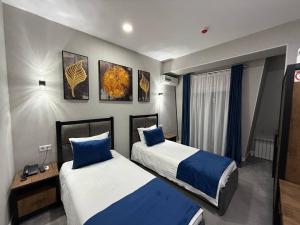 Ένα ή περισσότερα κρεβάτια σε δωμάτιο στο Merci in Tashkent Hotel +19 φωτογραφίες