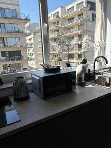 Køkken eller tekøkken på La Dolce Riva Apartments - Navodari Mamaia Nord