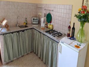 a kitchen with a sink and a counter top at Holiday Home for Families in Umbrian in Ramazzano