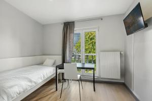 Ένα ή περισσότερα κρεβάτια σε δωμάτιο στο Hotel Engelsburg - Apartments - Ferienwohnungen