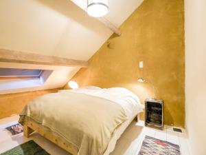 a bedroom with a bed in a room with a window at Holiday Home in Philippeville with garden in Philippeville