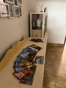 a table with magazines on it in a room at Susa and Pepe garden and house in Agaete
