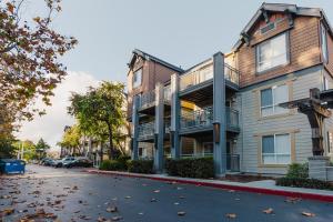 a apartment building with balconies on a street at Sunnyvale 1BR w Gym WD Lounge nr Google SFO-839 in Sunnyvale
