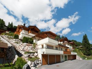 a house on the side of a mountain at Detached Chalet in Saalbach in Saalbach-Hinterglemm