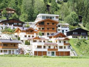 a group of houses on top of a hill at Detached Chalet in Saalbach in Saalbach-Hinterglemm +27 photos