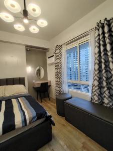 Postel nebo postele na pokoji v ubytování JPD Mesavirre Garden Residences