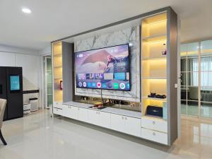 a large entertainment center with a tv in a living room at Elegant Home near MRT Central WestGate and Central WestVille 3 to 10 Min Drive 