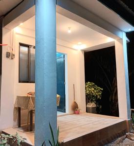 a room with a large window and a blue pole at Villa Catalina Bora 3 Resort in Nabas