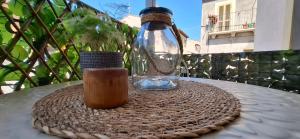 a glass bottle sitting on top of a table at Casa Vacanze al Vicoletto in Pratola Peligna +28 photos