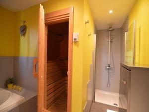 a bathroom with a walk in shower and a sink at Panoramic Retreat in Malmedy in Malmedy