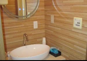 a bathroom with a sink and a mirror at Ikkyuan / Vacation STAY 3963 in Atami +18 photos