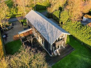 an overhead view of a house with a metal roof at Family House in Grou near Water Sports in Grou +29 photos