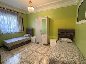 Ένα ή περισσότερα κρεβάτια σε δωμάτιο στο Appartement à louer à Tanger