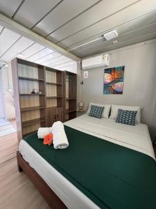 a bedroom with two beds in a boat at Tilakaz Kreol in Pointe d'Esny