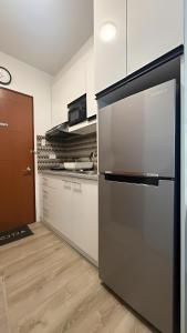 Kuchyň nebo kuchyňský kout v ubytování JPD Mesavirre Garden Residences