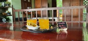 a tray with two drinks and bananas on a table at Sandy Lake 2012 in Kaeng Krachan +40 photos