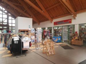 a clothing store with clothes on display in a building at Studio chaleureux de montagne in Ustou