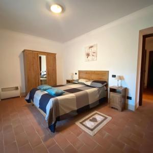 Ένα ή περισσότερα κρεβάτια σε δωμάτιο στο Fattoria San Rocco +83 φωτογραφίες