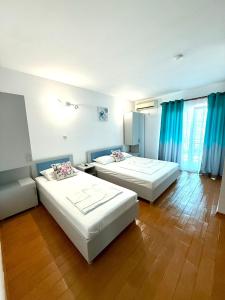 En eller flere senge i et værelse på EladaA