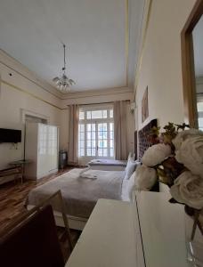 a bedroom with a bed and a large window at Pa la ce court in Cairo +61 photos