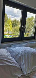 Ένα ή περισσότερα κρεβάτια σε δωμάτιο στο Wiejska 21