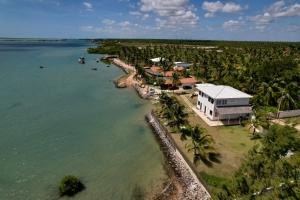 an aerial view of a house next to the water at Soulkite House Brazil in Itarema