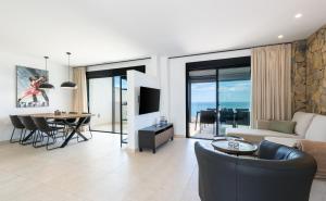 a living room with a couch and a table at MSW07 - 3 bedroom pool and jacuzzi in Torrox Costa